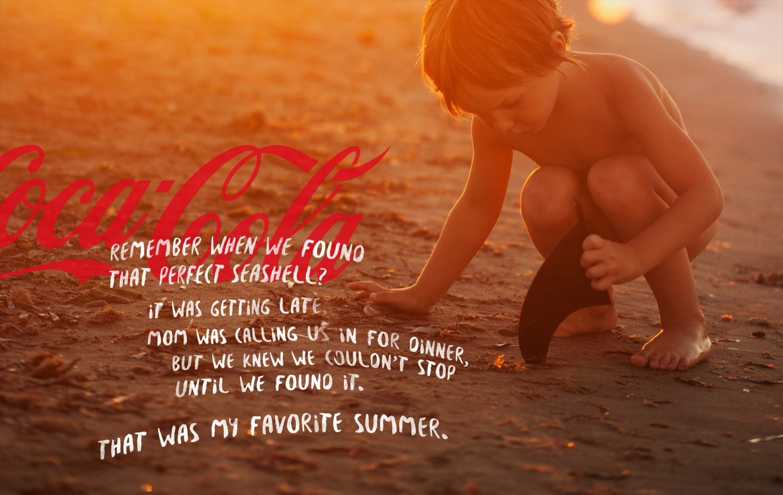 A child crouching on a sunset beach, the Coca-Cola script and a handwritten memory about finding the perfect seashell laid over the photograph