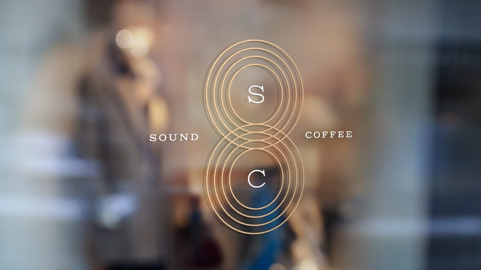 The Sound Coffee monogram etched in gold on the shop window